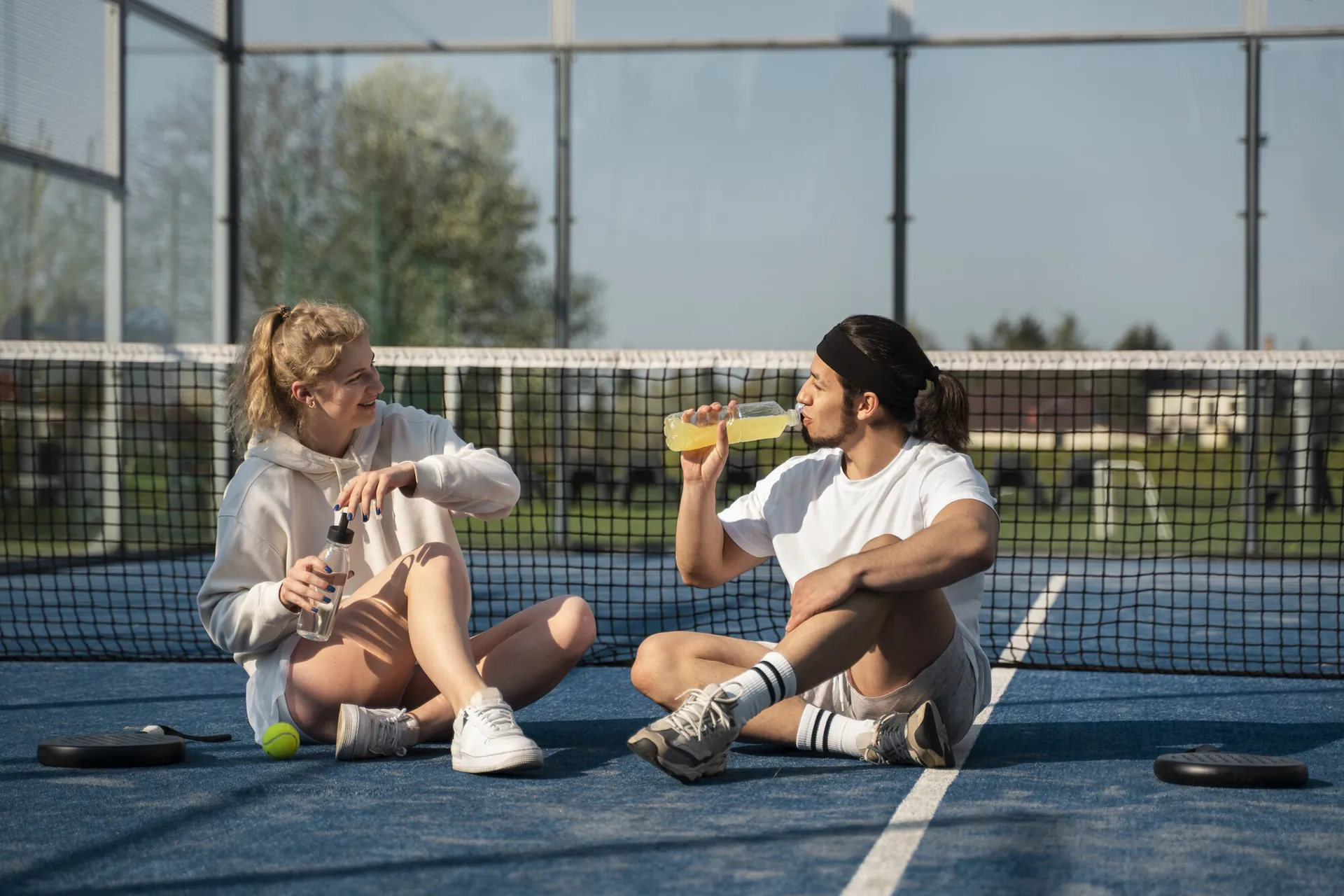 Players taking a break after pickleball coaching at The Social Court