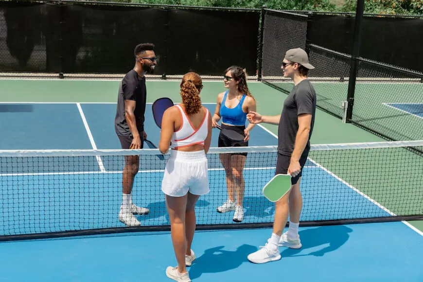 Players gathering on outdoor pickleball courts at The Social Court