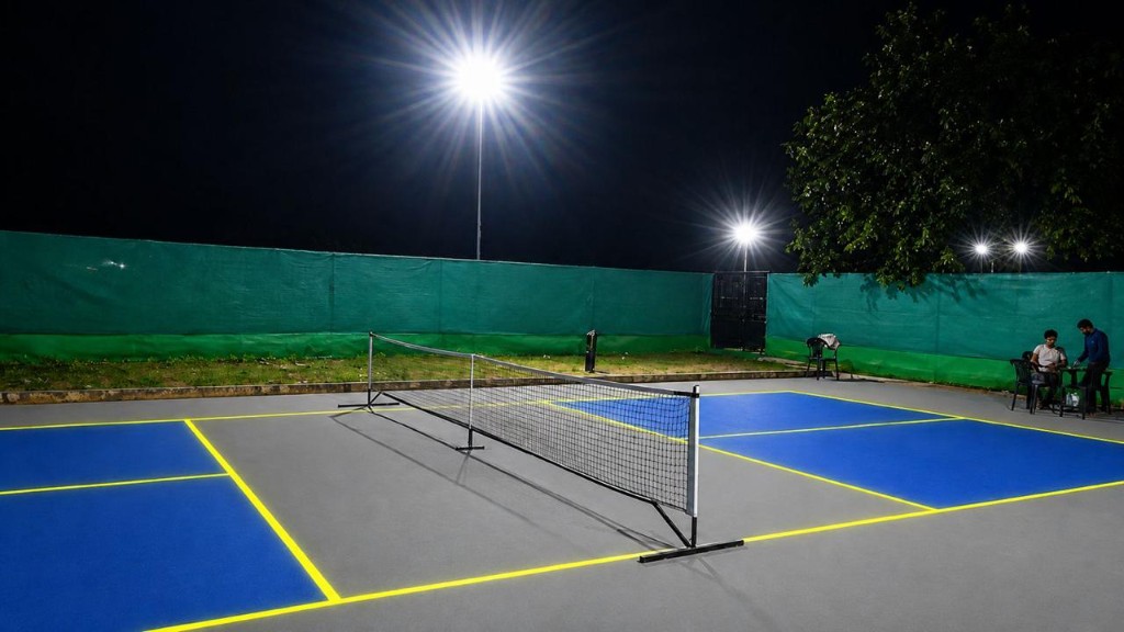 Pickleball net on a floodlit court at The Social Court Ambala