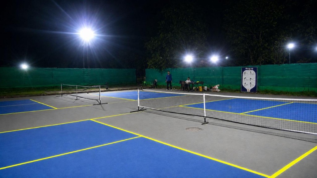 Night-lit outdoor pickleball courts at The Social Court Ambala
