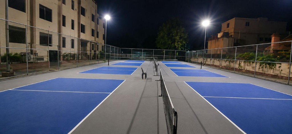 Night-lit outdoor pickleball courts at The Social Court, Sector 10 Gurugram
