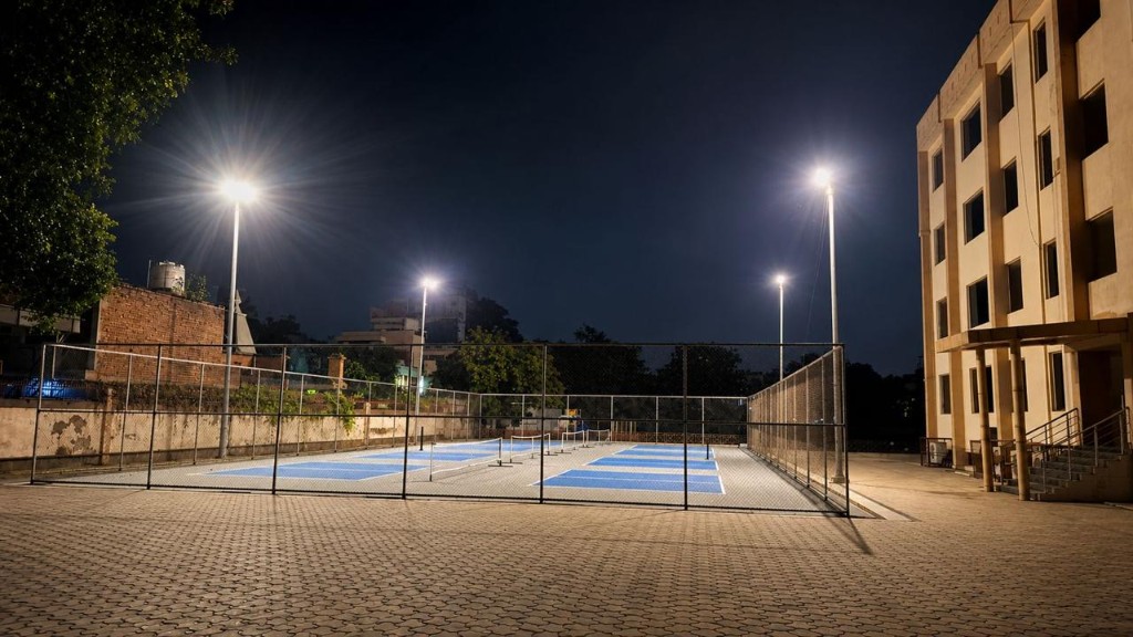 Floodlit pickleball courts at night at The Social Court Gurugram