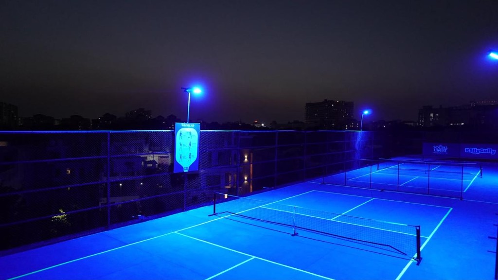 Night-lit rooftop pickleball courts at The Social Court Zirakpur